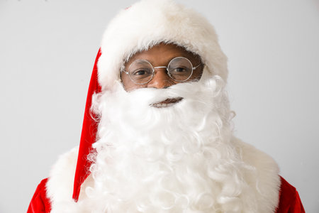 African-American Santa Claus on light backgroundの写真素材