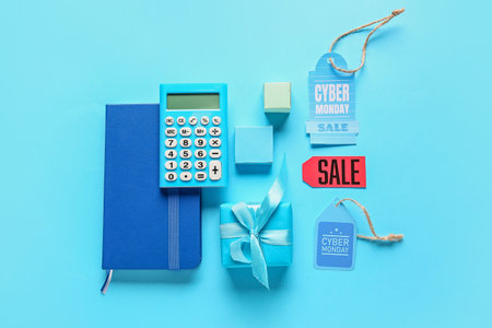 Gift boxes with calculator and tags with text CYBER MONDAY SALE on color background