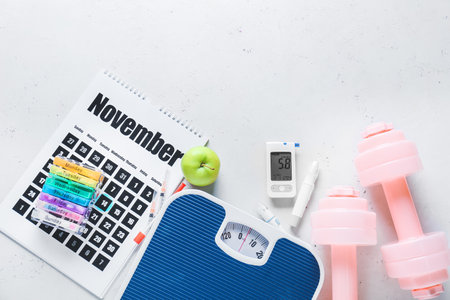 Glucometer, lancet pen, scales, dumbbells, syringes and calendar on white background. Diabetes conceptの写真素材