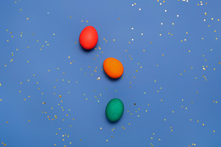 Colorful Easter eggs on blue backgroundの写真素材