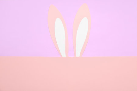 Paper rabbit ears on color backgroundの写真素材