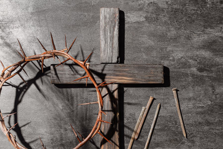 Crown of thorns with wooden cross and nails on dark background. good friday conceptの写真素材
