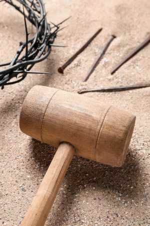 Mallet with crown of thorns and nails on sand, closeup. good friday conceptの写真素材