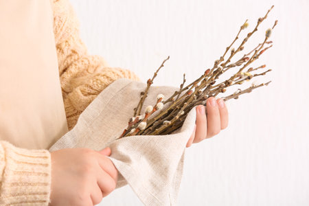 Woman holding willow branches, closeupの写真素材