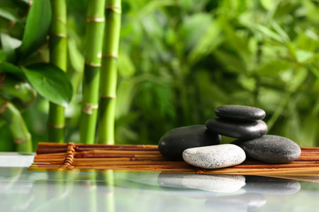 Stack of spa stones in green gardenの写真素材