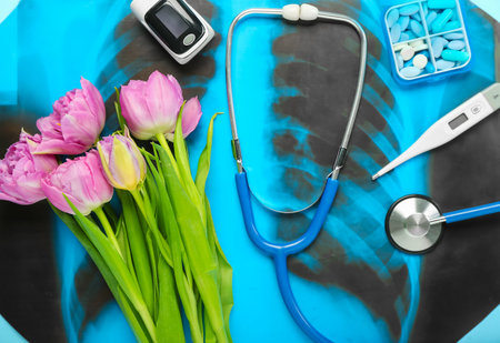 Medical supplies with tulips on blue background. hello spring