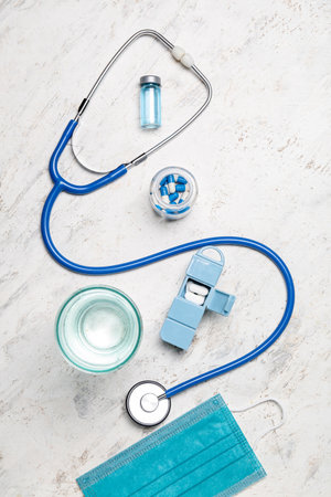 Medical supplies with glass of water on grunge background. world health dayの写真素材
