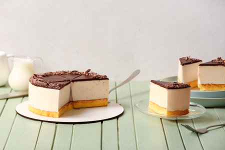 Delicious birds milk cake on color wooden tableの写真素材