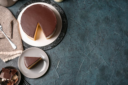 Composition with tasty birds milk cake and chocolate on dark color backgroundの写真素材