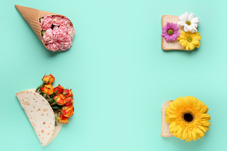Tortilla, bread and waffle cone with beautiful flowers on color backgroundの写真素材