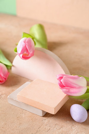 Composition with podiums, Easter eggs and tulip flowers on color background, closeupの写真素材
