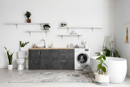Interior of bathroom with sink, toilet bowl and bathtubの写真素材
