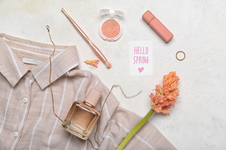 Composition with cosmetics, accessories, shirt and hyacinth flower on light backgroundの写真素材