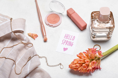 Composition with cosmetics, accessories, shirt and hyacinth flower on light background, closeupの写真素材