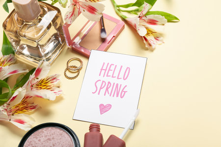 Composition with cosmetics, accessories, card and alstroemeria flowers on color background, closeup