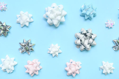 Beautiful bows made of ribbons on blue backgroundの写真素材