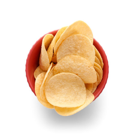 Bowl with delicious potato chips isolated on white backgroundの写真素材