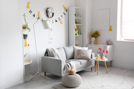 Interior of living room decorated for Easter celebration with wreath and sofaの写真素材