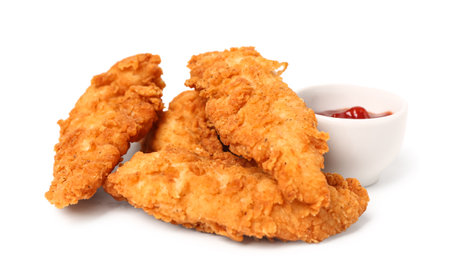 Delicious nuggets and bowl of sauce on white backgroundの写真素材