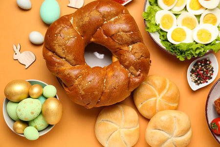 Tasty dishes for Easter dinner on color background, closeupの写真素材
