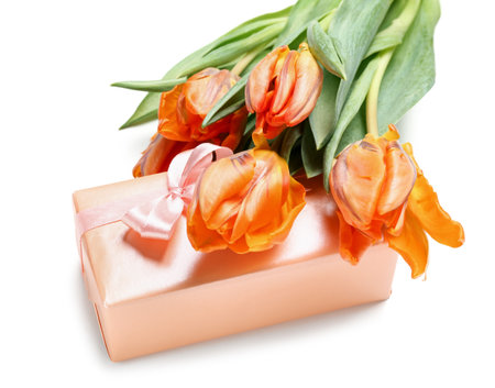 Gift box and beautiful tulip flowers for Mother's Day celebration on white background, closeupの写真素材