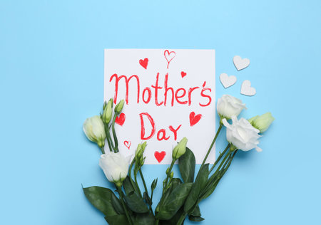 Card with text MOTHER'S DAY and beautiful eustoma flowers on color background
