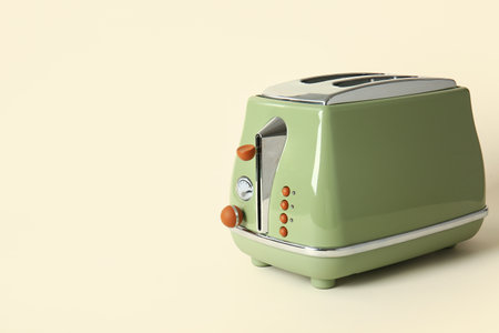 Modern toaster on beige backgroundの写真素材