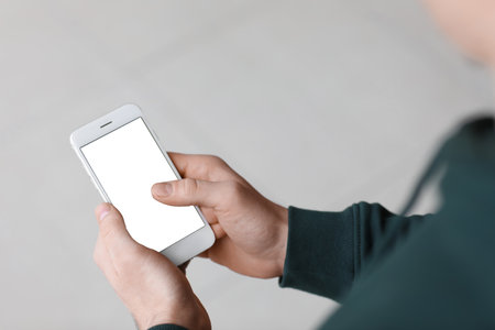 Man using mobile phone, closeupの写真素材