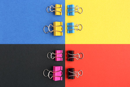 Composition with binder clips on color backgroundの写真素材