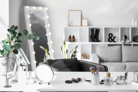 Interior of light makeup room with table, mirror and sofaの写真素材