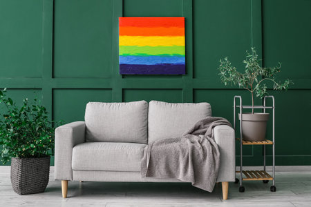 Interior of stylish living room with rainbow painting, sofa and houseplantsの写真素材
