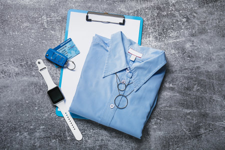 Female shirt and accessories on dark background