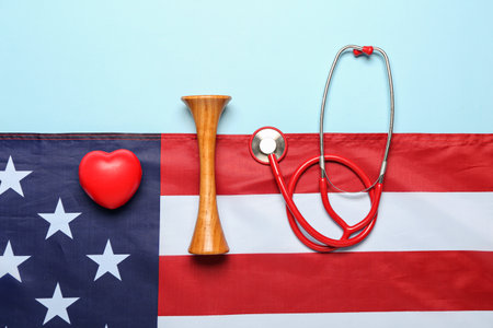 Stethoscopes with heart and USA flag on blue backgroundの写真素材
