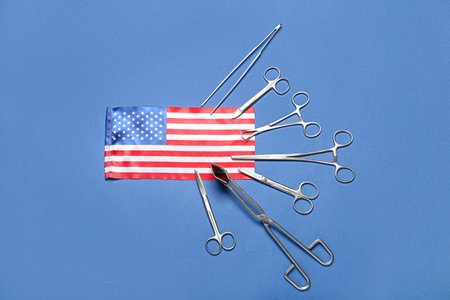 Surgical instruments and USA flag on blue backgroundの写真素材