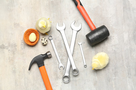 Handyman's tools with chickens and Easter eggs on grunge backgroundの写真素材