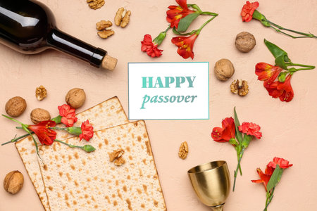 Composition with greeting card, Jewish flatbread matza for Passover, walnuts and flowers on color...