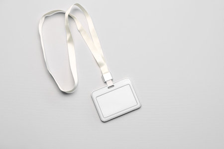 Blank badge with lanyard on light backgroundの写真素材