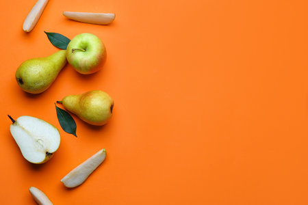 fresh pear and apple on color background