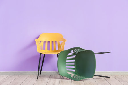 modern chairs near color wallの写真素材