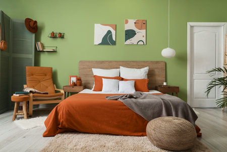 Stylish interior of bedroom with comfortable bedの写真素材