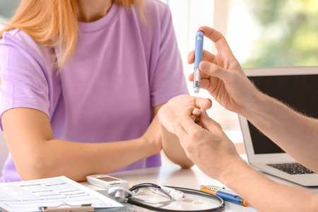 Diabetic woman visiting doctor in clinicの写真素材