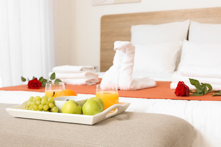 Tray with fruits in modern hotel honeymoon roomの写真素材