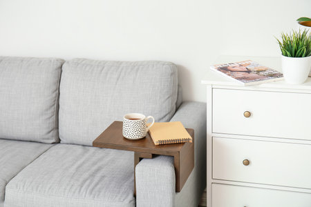 Armrest table on sofa in interior of roomの写真素材