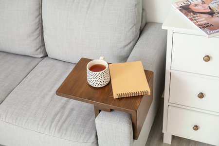 Armrest table on sofa in interior of roomの写真素材