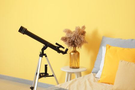 Interior of modern bedroom with telescopeの写真素材