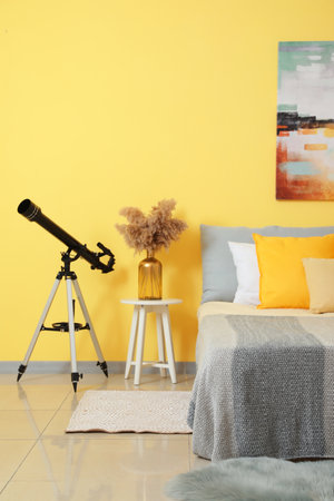 Interior of modern bedroom with telescopeの写真素材