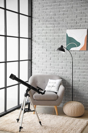 Interior of modern room with telescopeの写真素材