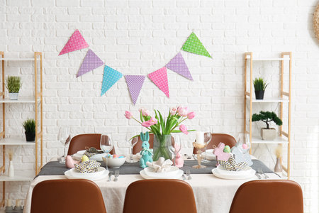 Interior of dining room with table served for Easter celebration