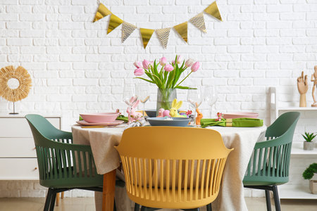 Interior of dining room with table served for Easter celebrationの写真素材
