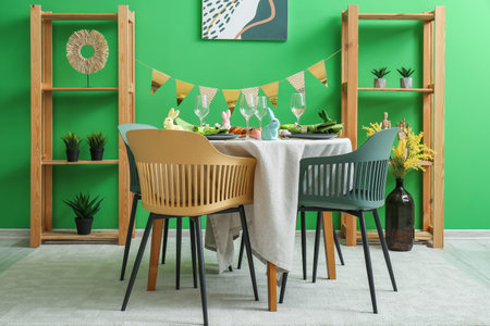 Interior of dining room with table served for Easter celebrationの写真素材